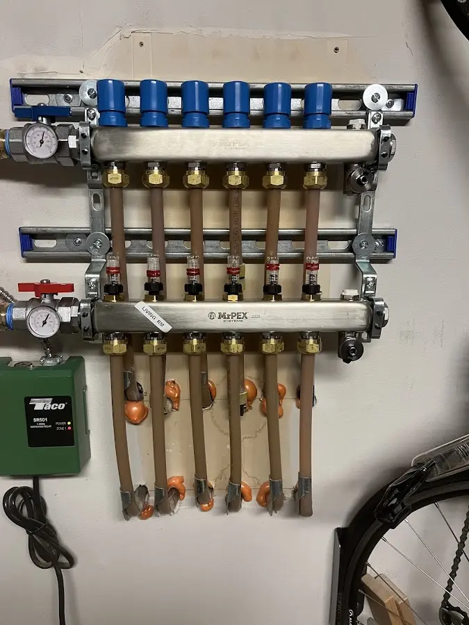 Plumber performing Water Heater Repair at a residential property in Madill